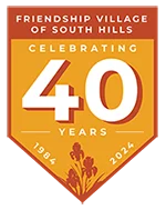 Friendship Village 40th anniversary emblem, 1984-2024, with floral design.