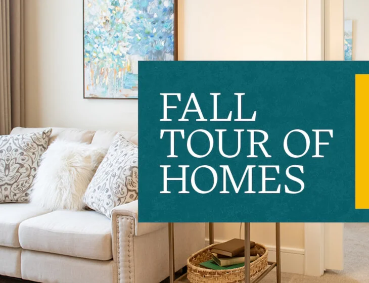 Living room shot of Friendship Village residence showing couch with event text: Fall Tour of Homes.