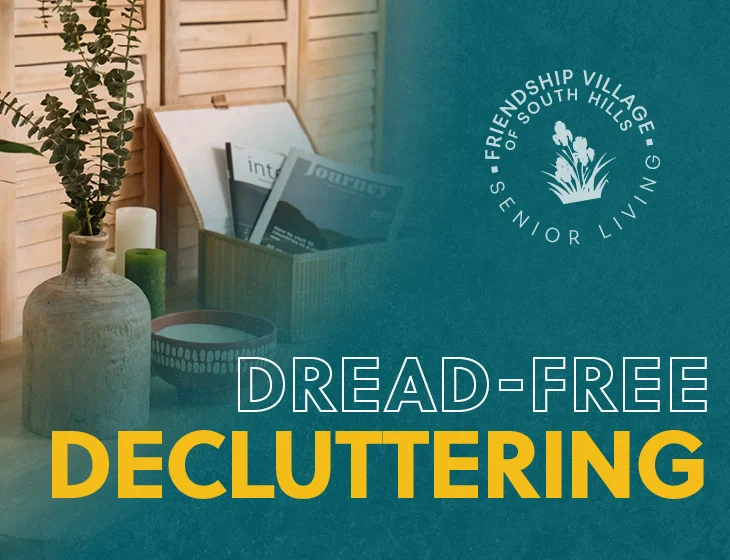 Miscellaneous items like vase, magazines, and candle on table with text: Dread-Free Decluttering