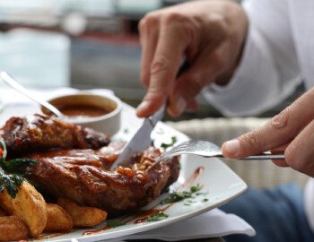 Man having lunch close up, Grilled pork spare ribs