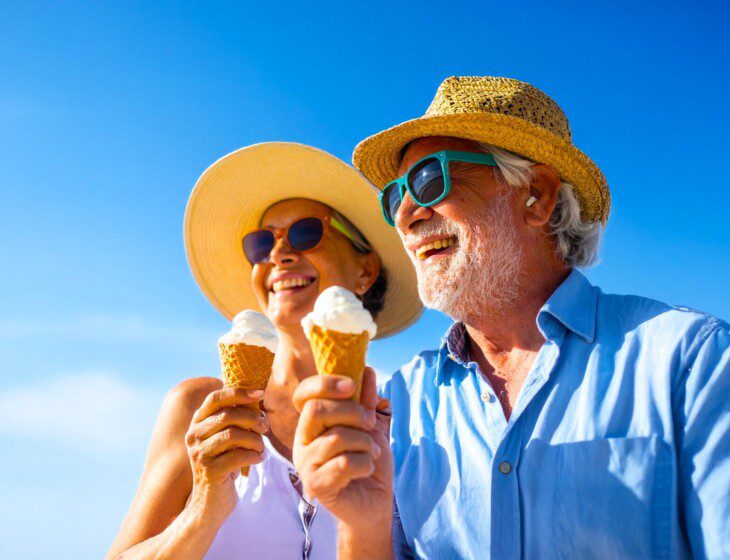 Firefly_a very young senior couple smiling and enjoying an ice cream wearing vibrant color su 202411